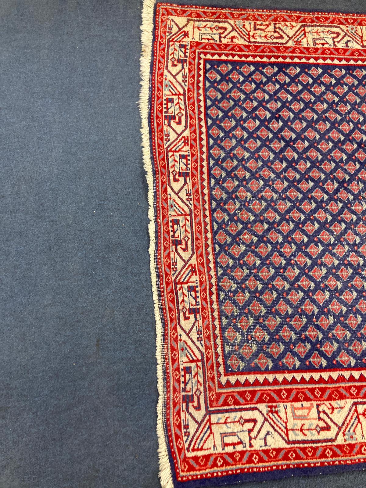 A North West Persian blue ground rug, 160 x 100cm